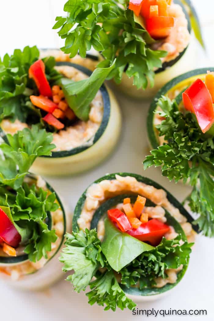 These QUICK and EASY zucchini roll ups are filled with a mixture of quinoa, hummus and fresh veggies | simplyquinoa.com | gluten-free + vegan