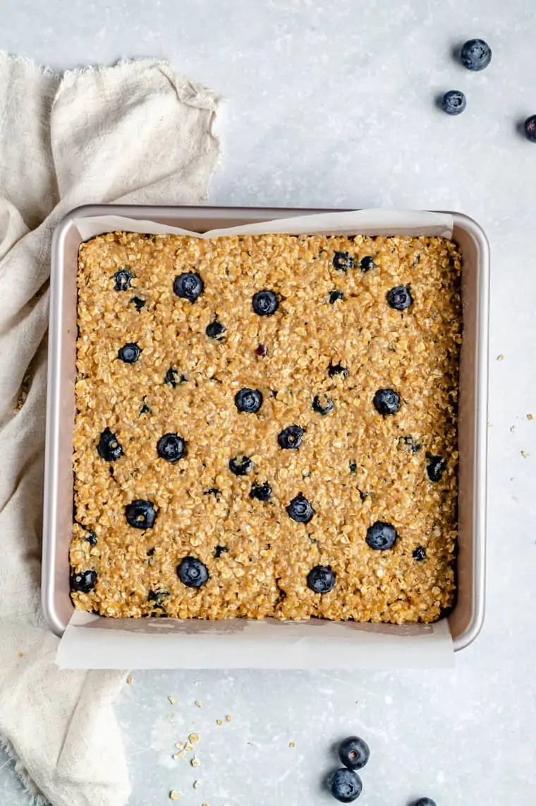 overhead of a baking dish with blueberry quinoa bars after baking
