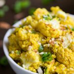 Curry Cauliflower Quinoa Salad with a creamy tahini dressing, almonds + scallions | gluten-free + vegan | recipe on simplyquinoa.com