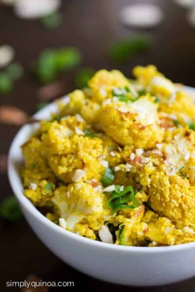 Curry Cauliflower Quinoa Salad with a creamy tahini dressing, almonds + scallions | gluten-free + vegan | recipe on simplyquinoa.com