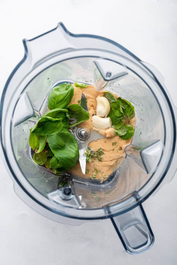 Overhead view of ingredients for tahini sauce in blender