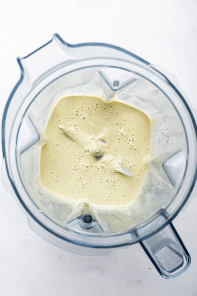 Overhead view of tahini sauce in blender