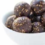Dark Chocolate + Tahini Quinoa Energy Bites in a bowl.