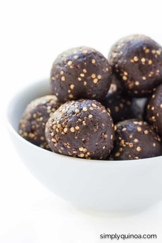 Dark Chocolate + Tahini Quinoa Energy Bites in a bowl.