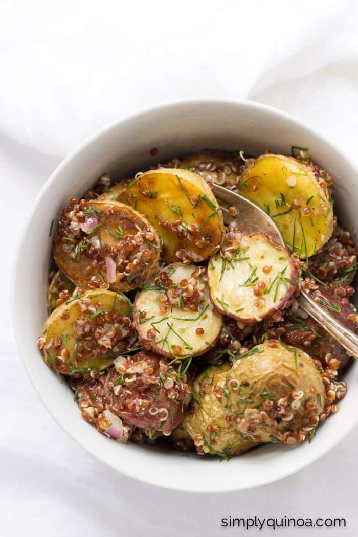 The perfect potato salad using roasted new potatoes, red quinoa and served with a shallot-caper dressing - so easy and SO delicious!