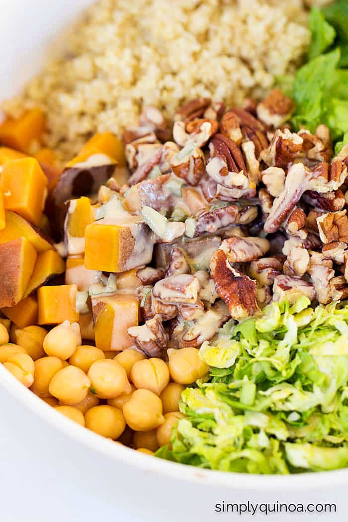 DIY Chopped Quinoa Salad...autumn style! With loads of seasonal veggies, all dressed in a quick apple cider + tahini-sage dressing