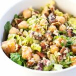 This autumn chopped quinoa salad is tossed with seasonal vegetables and dressed in a creamy tahini, sage and apple cider vinaigrette {healthy + vegan}