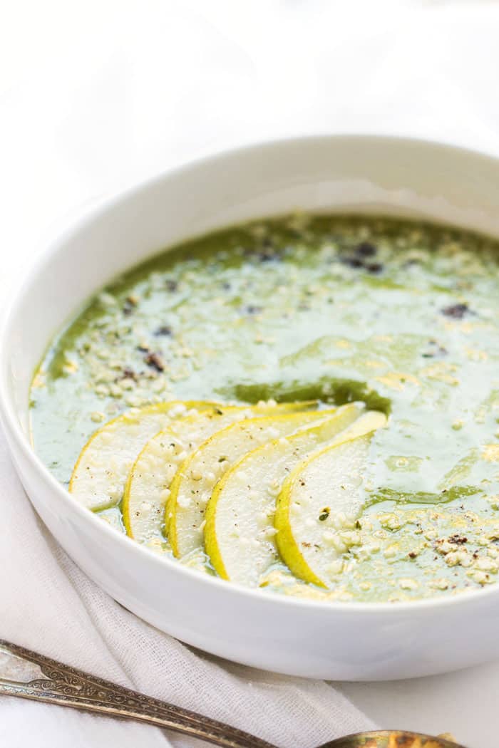 A simple green smoothie bowl made with pears, cashews, dates and vanilla that tastes JUST like a big bowl of ice cream!