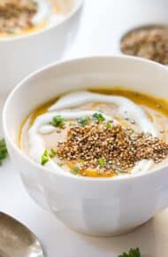Vegan Gingered Carrot Bisque from the new Food52 Cookbook - topped with a heaping serving of crispy garlic quinoa