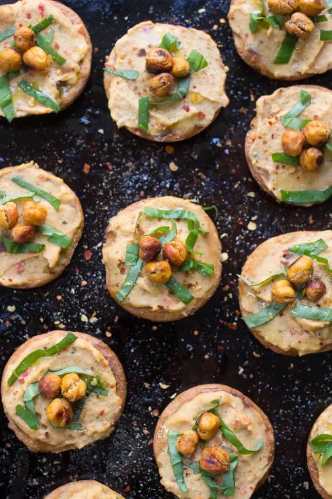 Mini Quinoa Pizza Bites with hummus and crispy chickpeas -- a perfect appetizer that's easy, healthy and packed full of protein! [vegan + gluten-free]