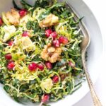 Kale + Shredded Brussels Sprout Quinoa Salad with pomegranates and toasted walnuts -- quick, easy and perfect for detoxing during the holidays!