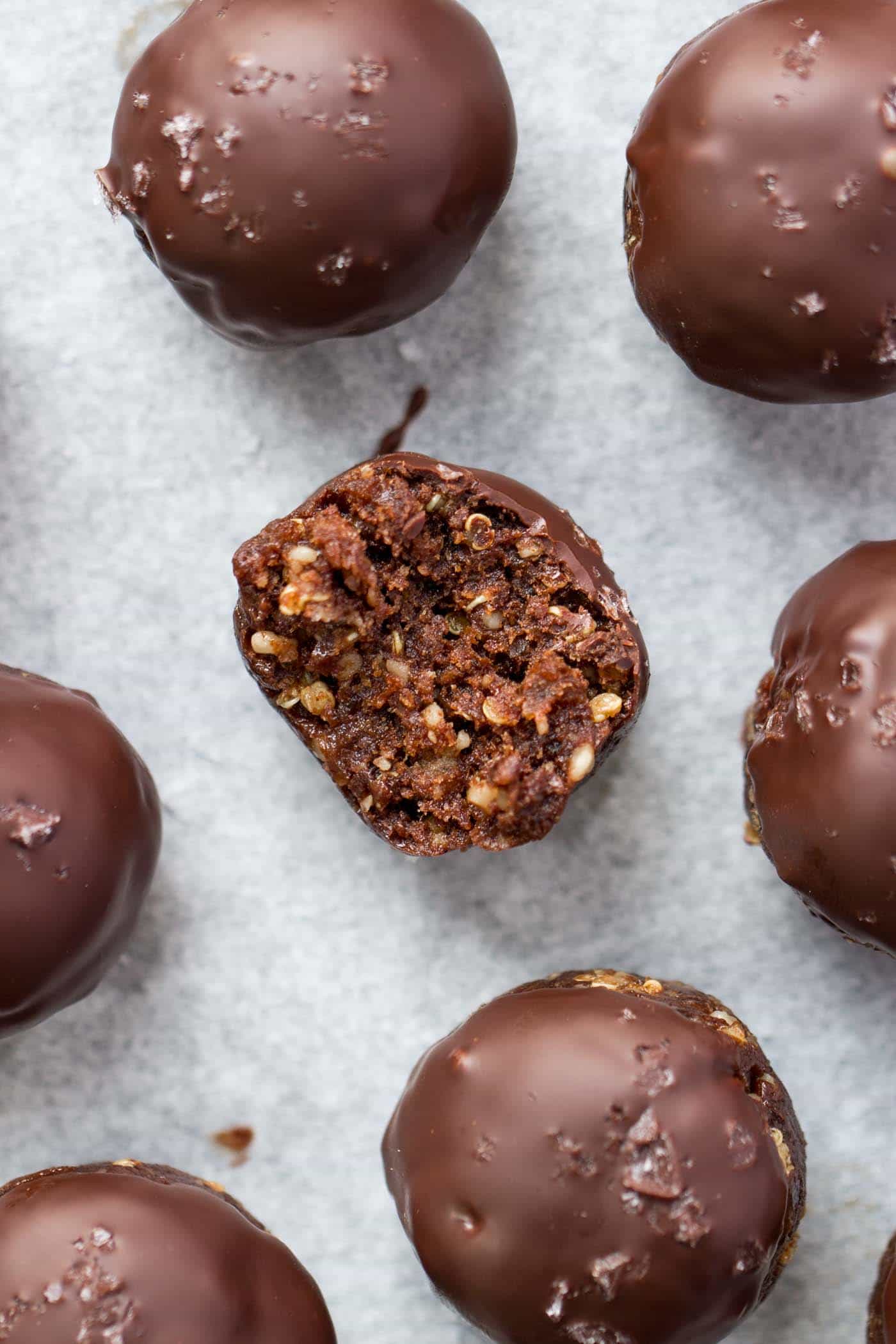 The BEST quinoa energy balls ever -- double dark chocolate + sea salt! They taste like candy, but are actually good for you! [vegan + gf]