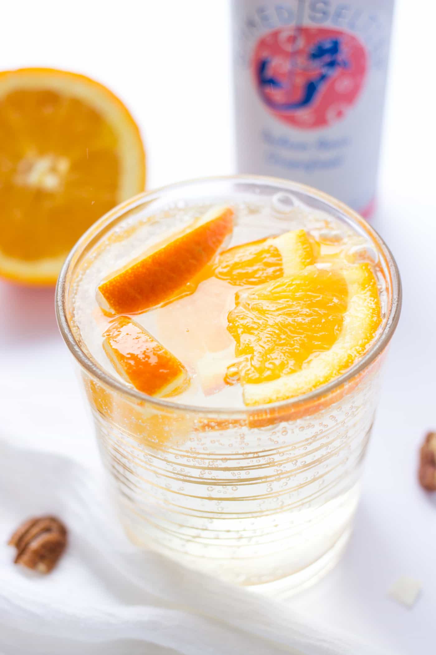 Brunch cocktail recipe with only 2 ingredients -- Grapefruit SpikedSeltzer and Sliced Oranges! Beats a mimosa anytime!