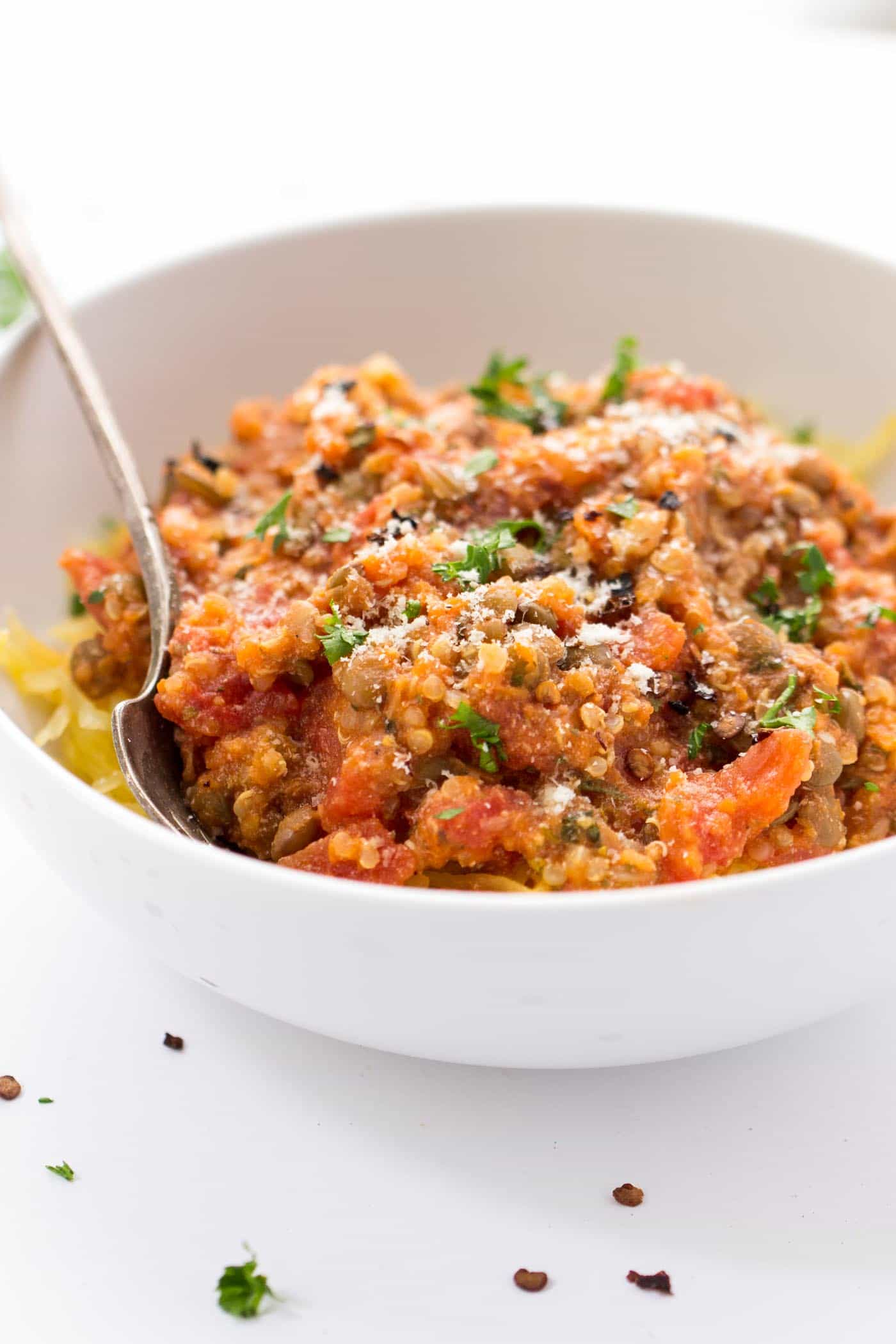 Super HEALTHY + simple lentil bolognese sauce with quinoa and served over low-cal spaghetti squash [vegan]