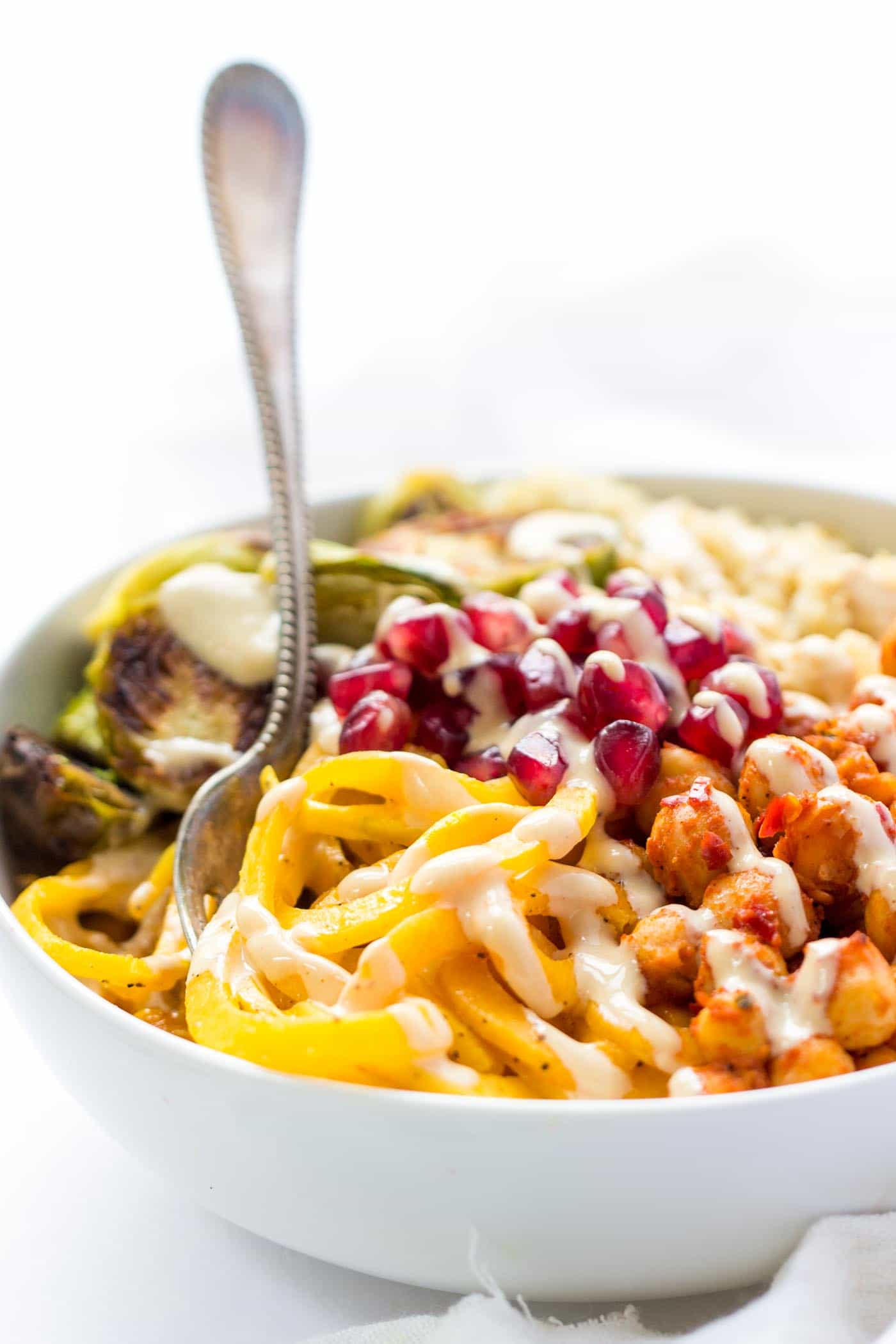 Spiralized Butternut Squash NOODLE BOWLS with quinoa, harissa chickpeas, roasted brussels sprouts and a vegan tahini-miso dressing [VEGAN + GF]