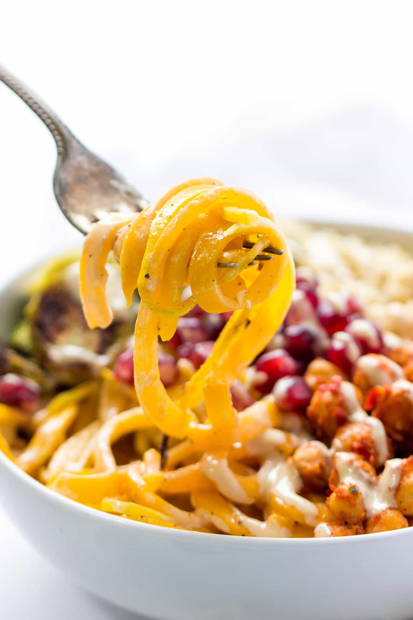 Perfect VEGAN + SPIRALIZED butternut squash noodle bowls with quinoa, brussels sprouts, pomegranates and more!