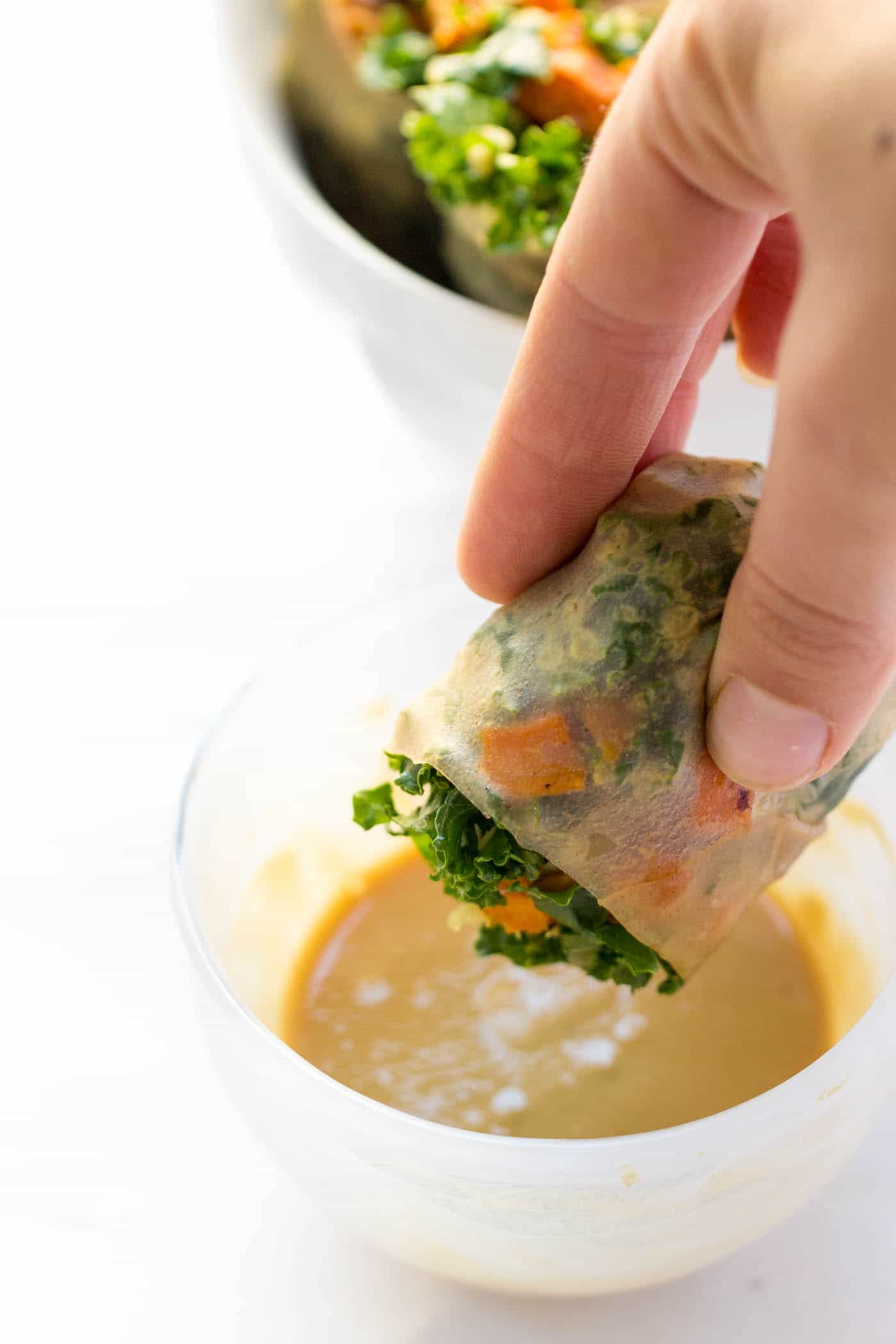 Simple Quinoa Spring Rolls made with kale and roasted sweet potato, and dipped in a miso-tahini dressing [VEGAN]