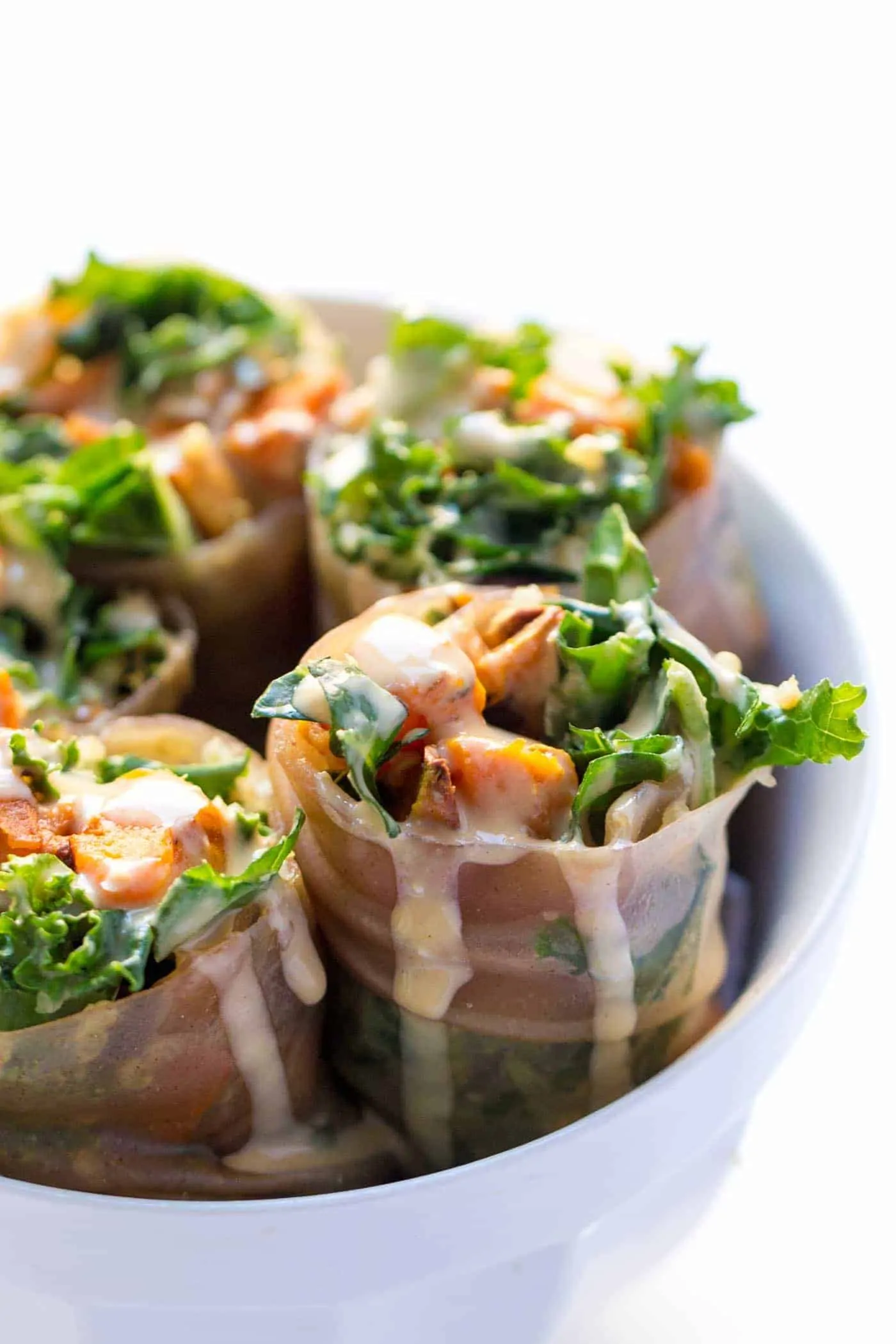 Sweet Potato + Kale Quinoa Spring Rolls -- a seasonal spin on a delicious gluten-free meal (they make great leftovers too!)