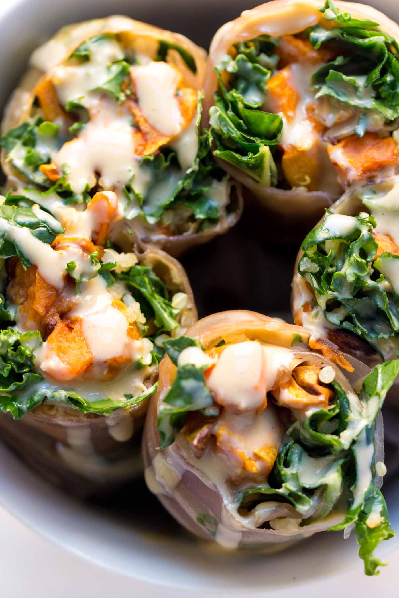 Seasonal Quinoa Spring Rolls made with roasted sweet potato, massaged kale salad, quinoa and wrapped in brown rice papers {vegan + gf}
