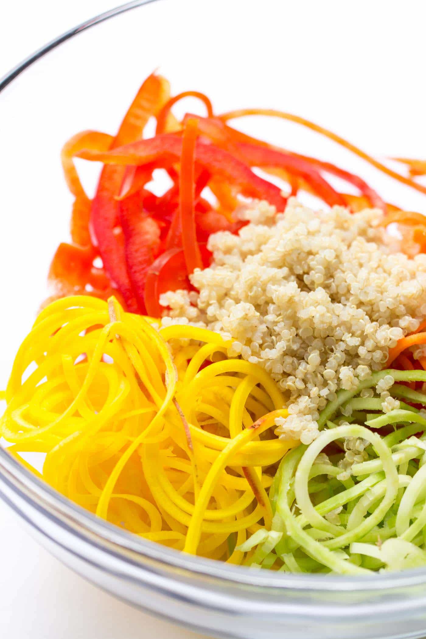 How to make a simple quinoa power salad: combine spiralized veggies, quinoa and crispy chickpeas with a creamy almond butter dressing [VEGAN]