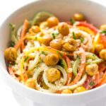 a SUPER SIMPLE quinoa salad made with spiralized veggies and crispy chickpeas (topped with an almond butter dressing!)