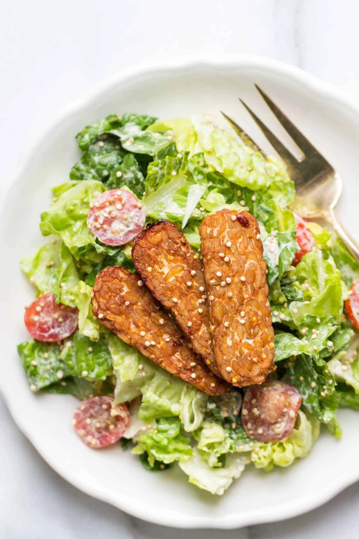 Vegan Caesar Salad made with a cashew-less dressing and baked tempeh strips - so easy and SO delicious!