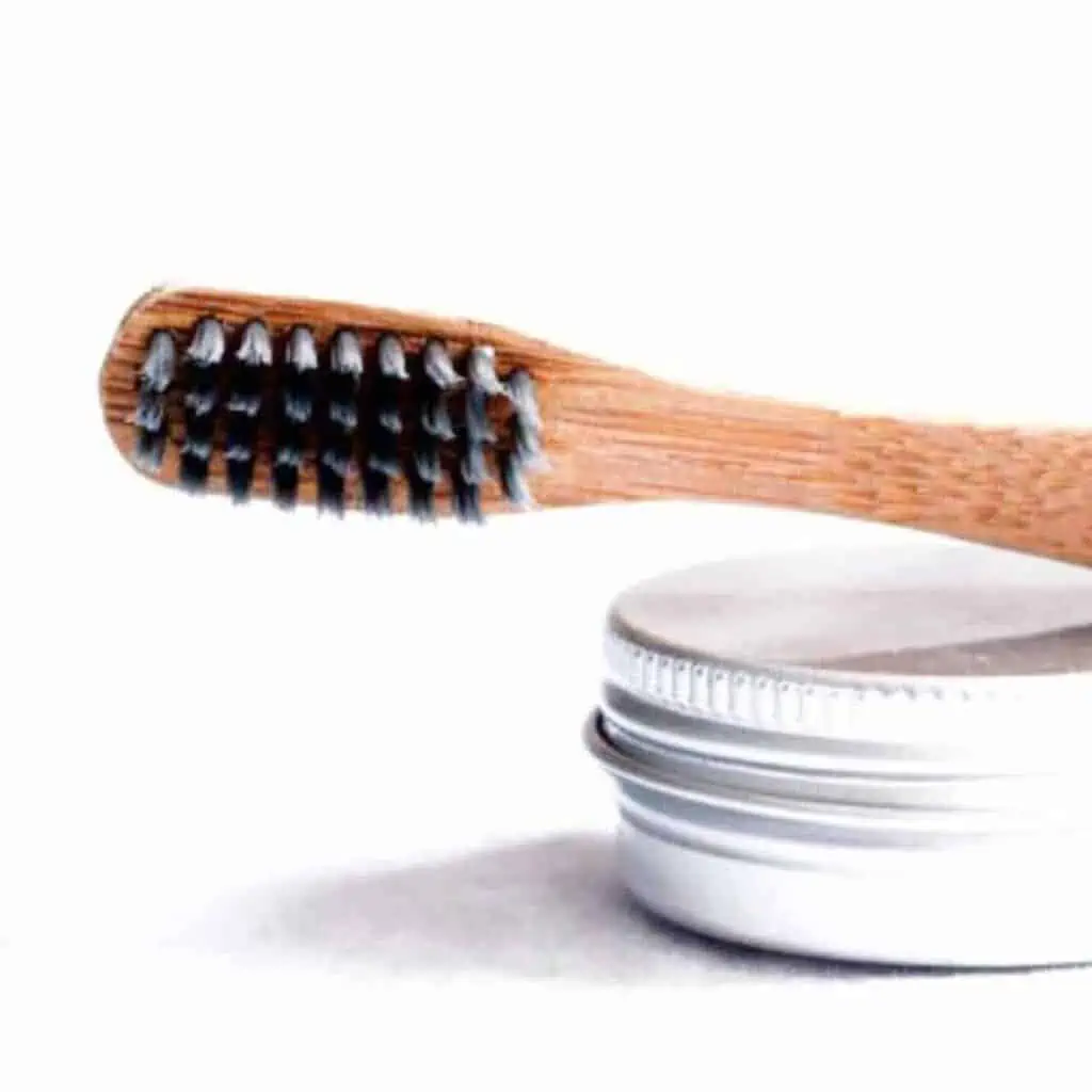 Toothbrush with toothpaste canister