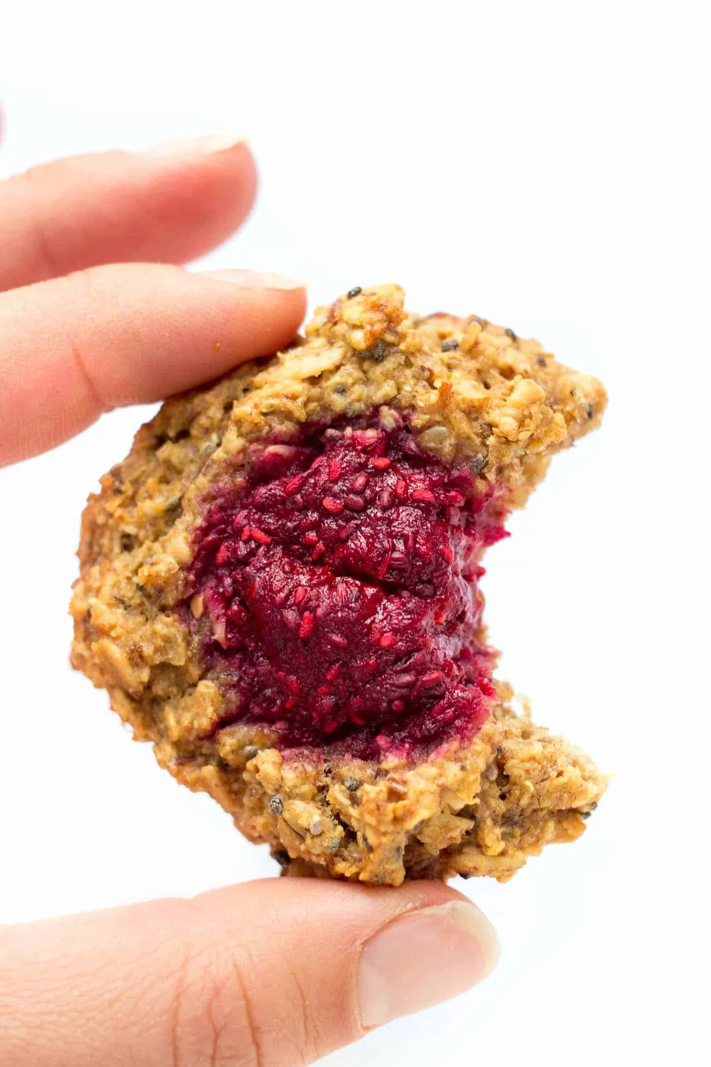 These QUINOA breakfast cookies are absolute perfection! A chewy peanut butter cookie base topped with healthy raspberry chia jam. [gluten-free + vegan]