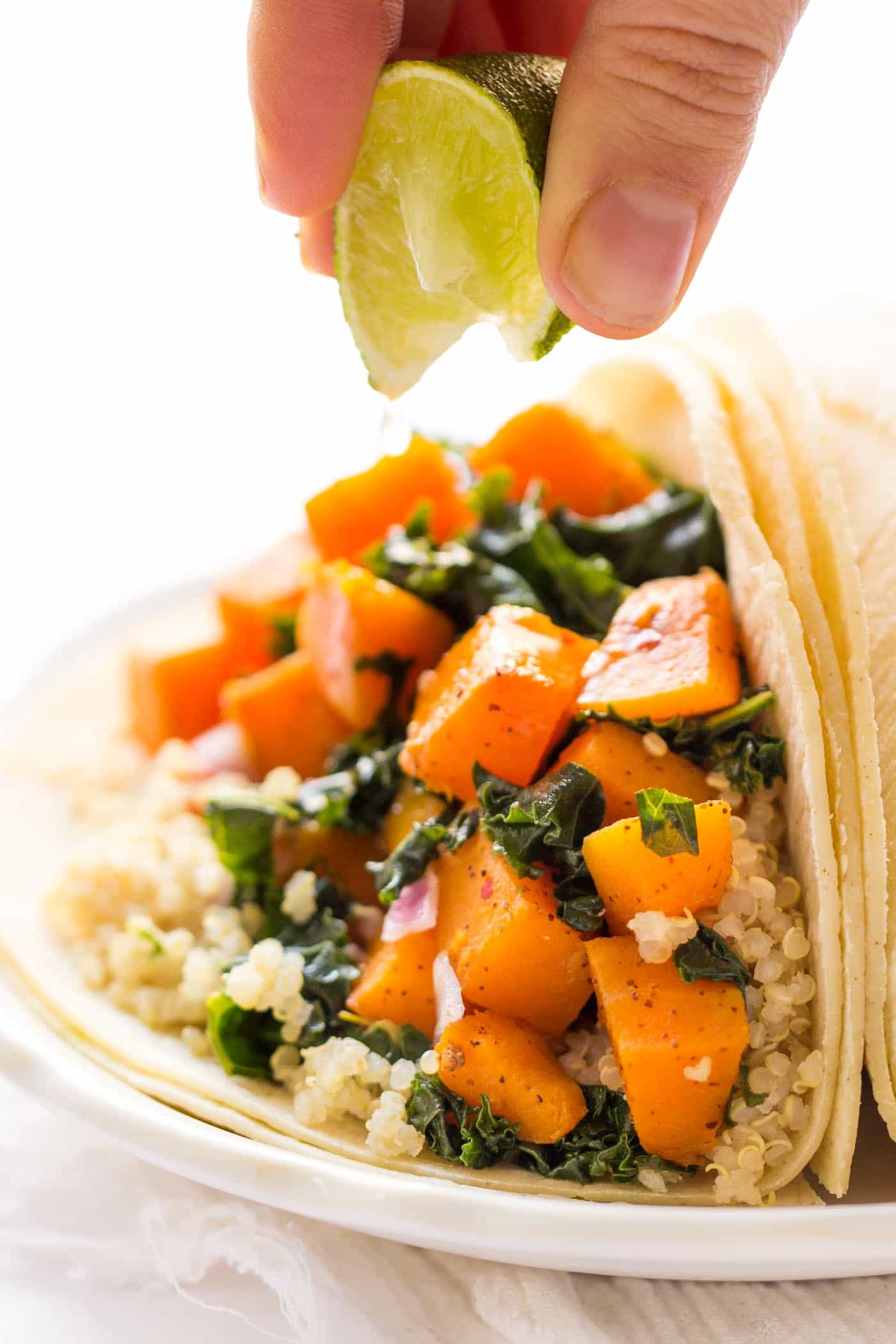 Savory Quinoa Breakfast Tacos -- with chili roasted butternut squash + kale. So simple and SO delicious!