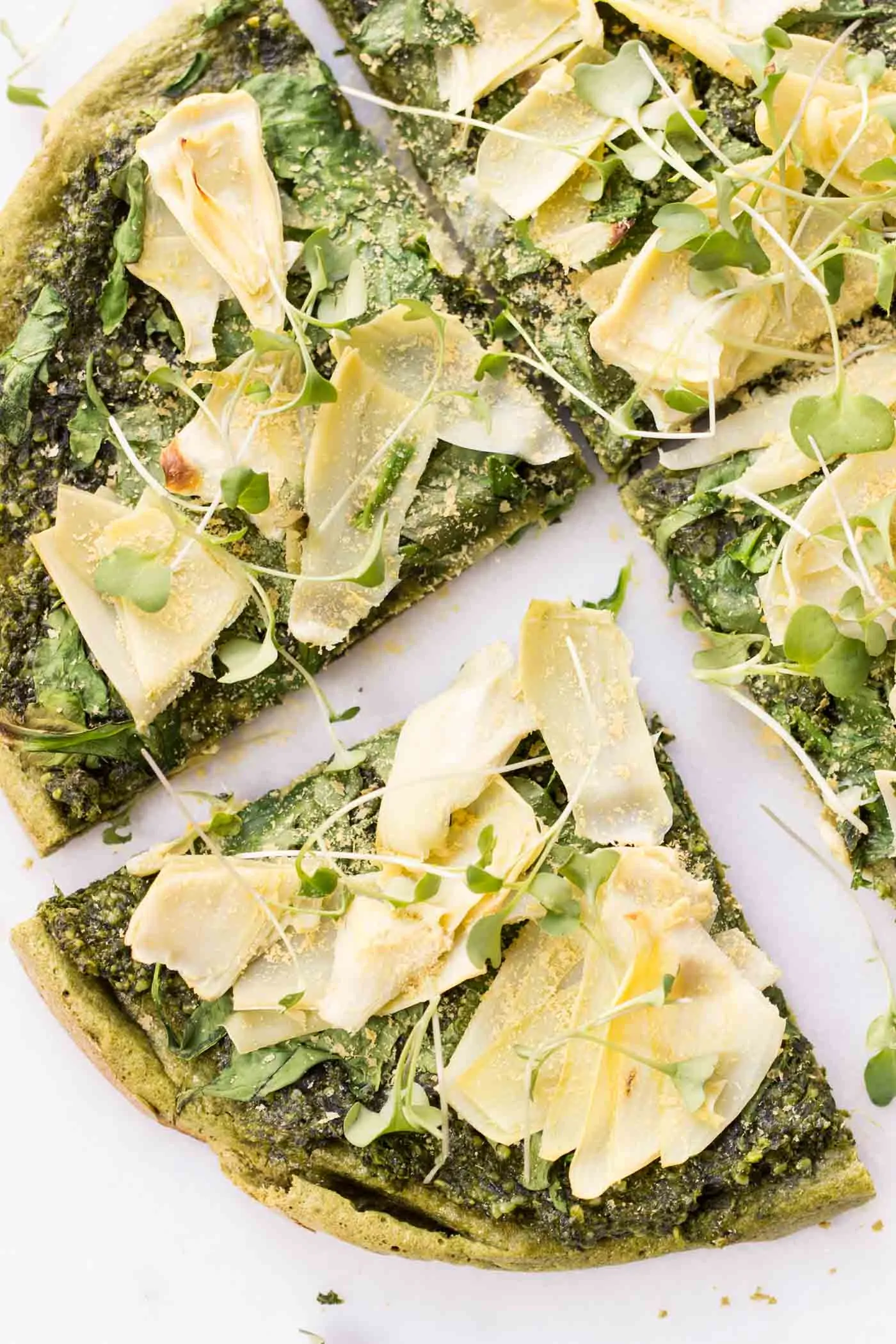 Spinach + Artichoke Quinoa Pizza -- a healthy, vegan pizza that's packed with tons of green veggies!