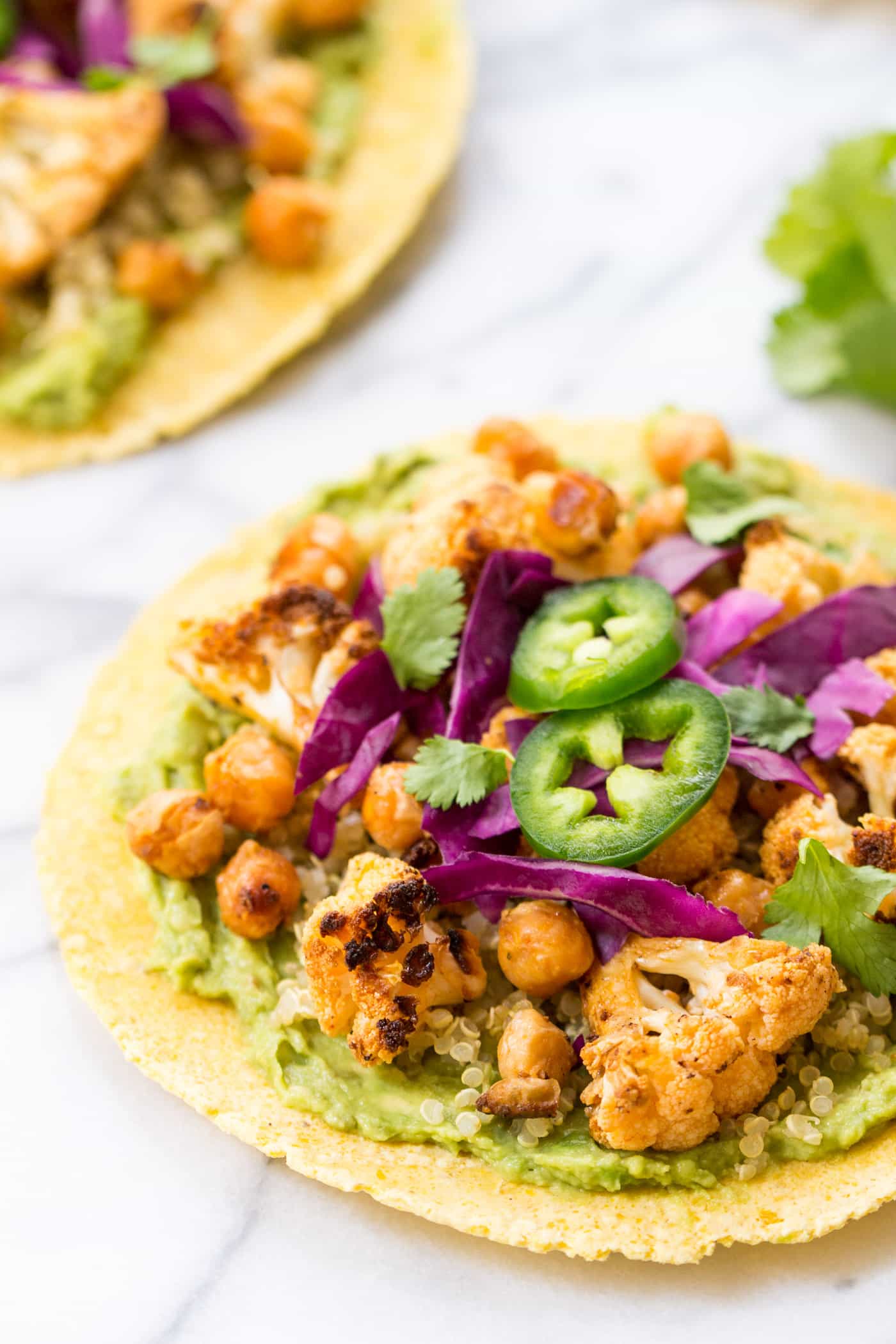 These EASY buffalo cauliflower + quinoa tacos are an awesome MEATLESS option when you need a quick and simple dinner!