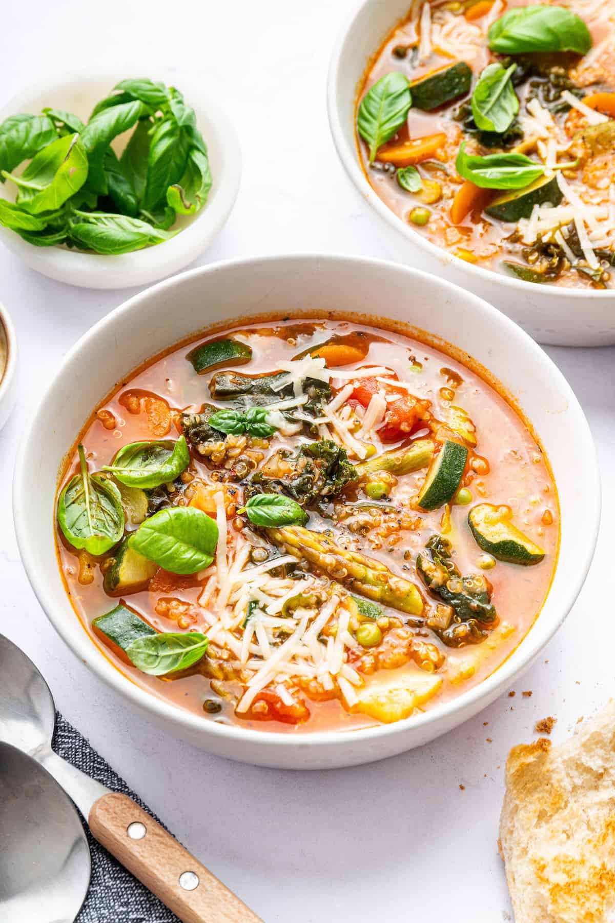 Vegetarian minestrone soup in bowl, with second bowl in background