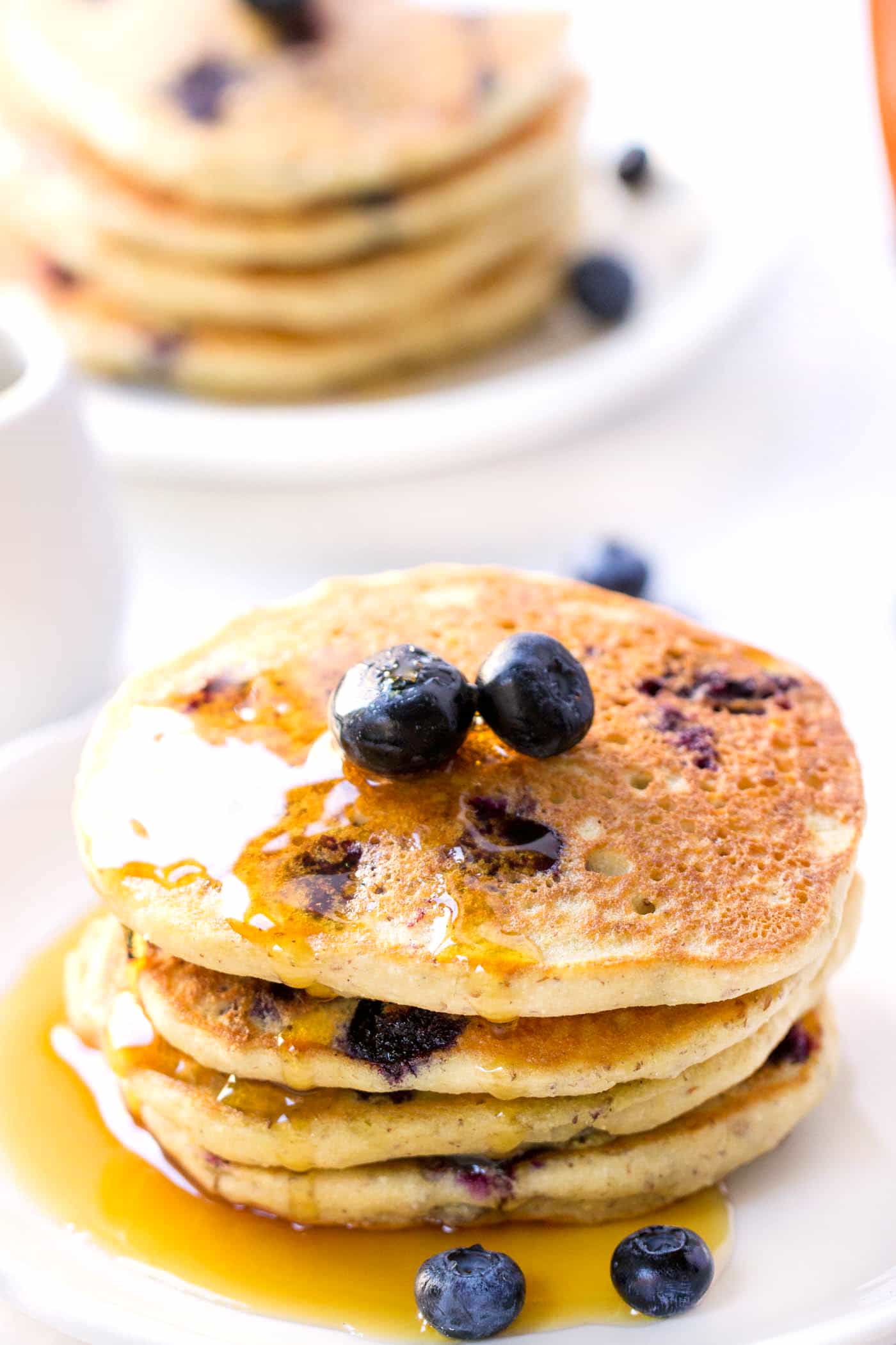 The FLUFFIEST Blueberry Quinoa Pancakes ever. Vegan, gluten-free + with a secret ingredient that give them an AMAZING texture!