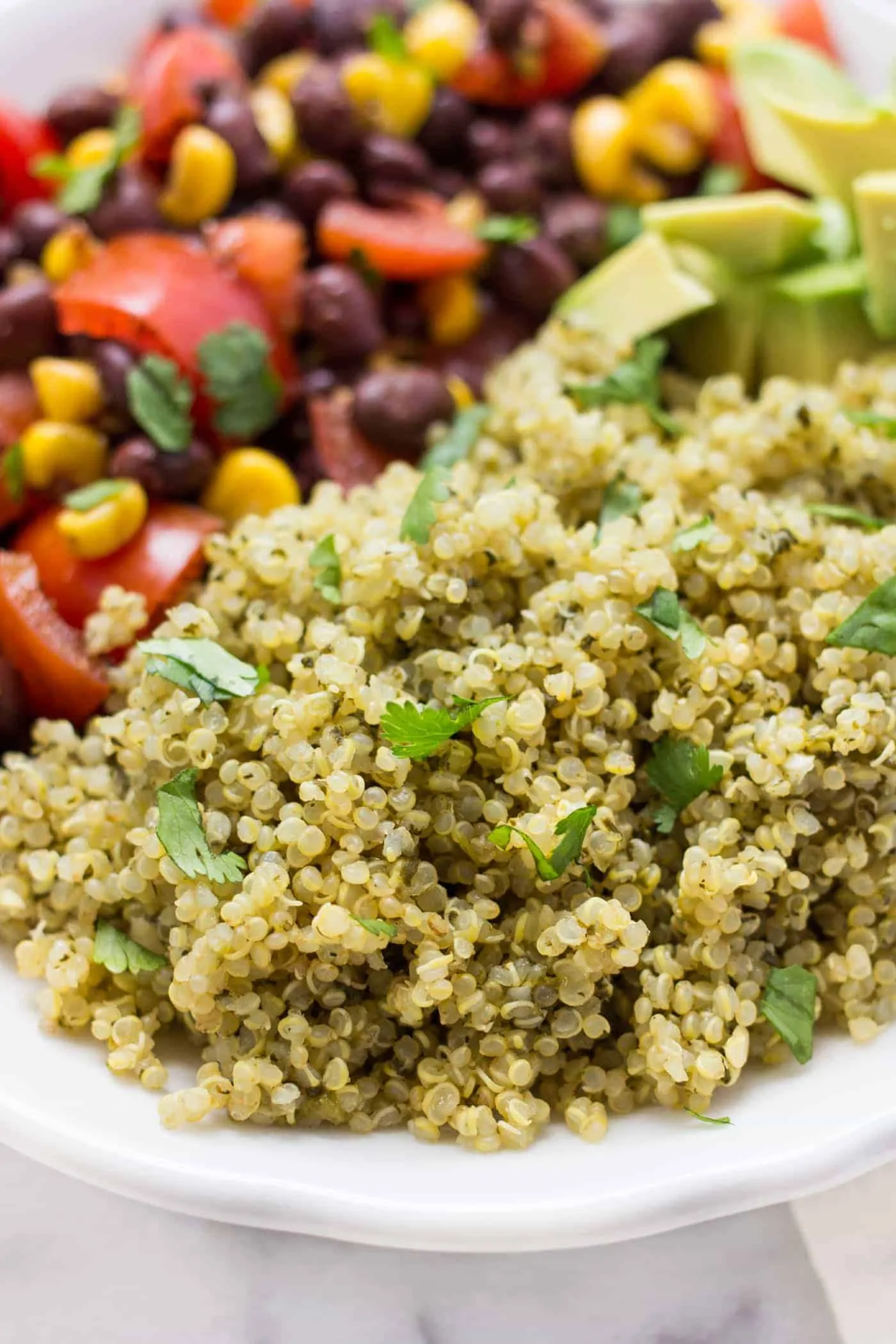 Spicy Green Mexican Quinoa -- a super easy recipe that can be served with pretty much anything! Like Chipotle's Cilantro Lime Rice only BETTER!