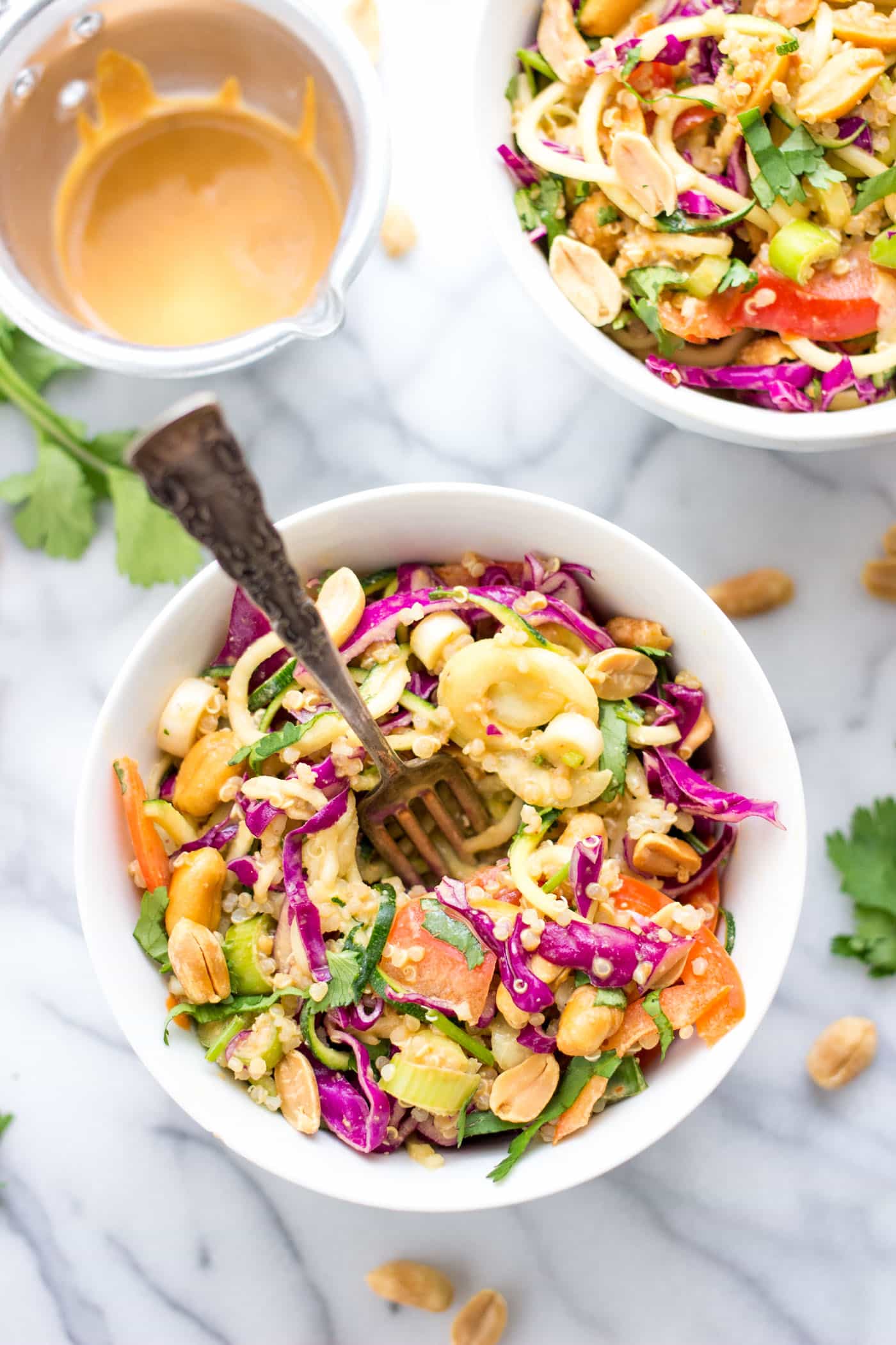 Healthy Pad Thai Zucchini Noodle Salad with veggies, quinoa and a creamy peanut butter sauce. So simple and SO flavorful!