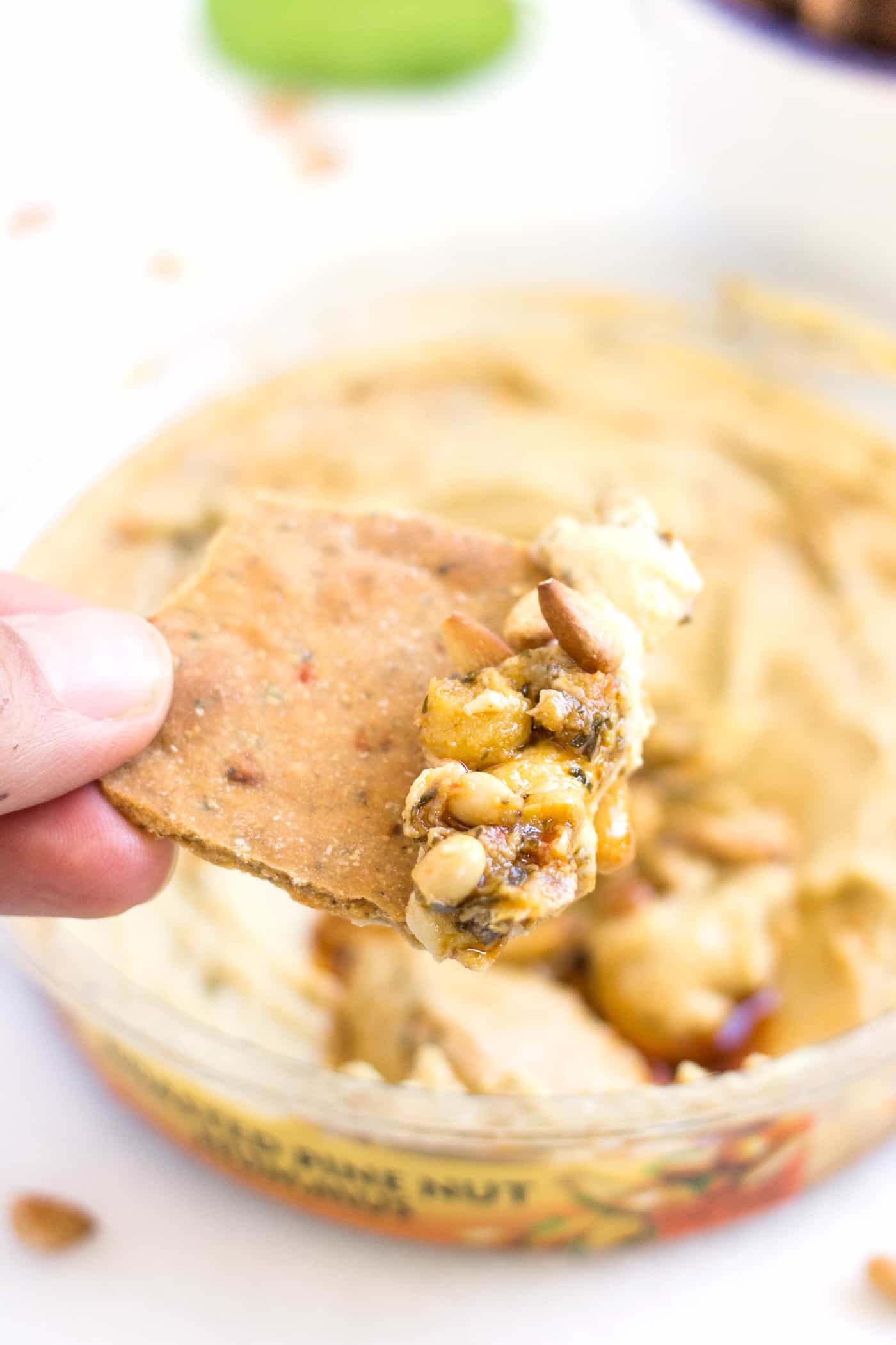 SIMPLE QUINOA CRACKERS dipped in a roasted pine nut hummus...the perfect snack or appetizer!