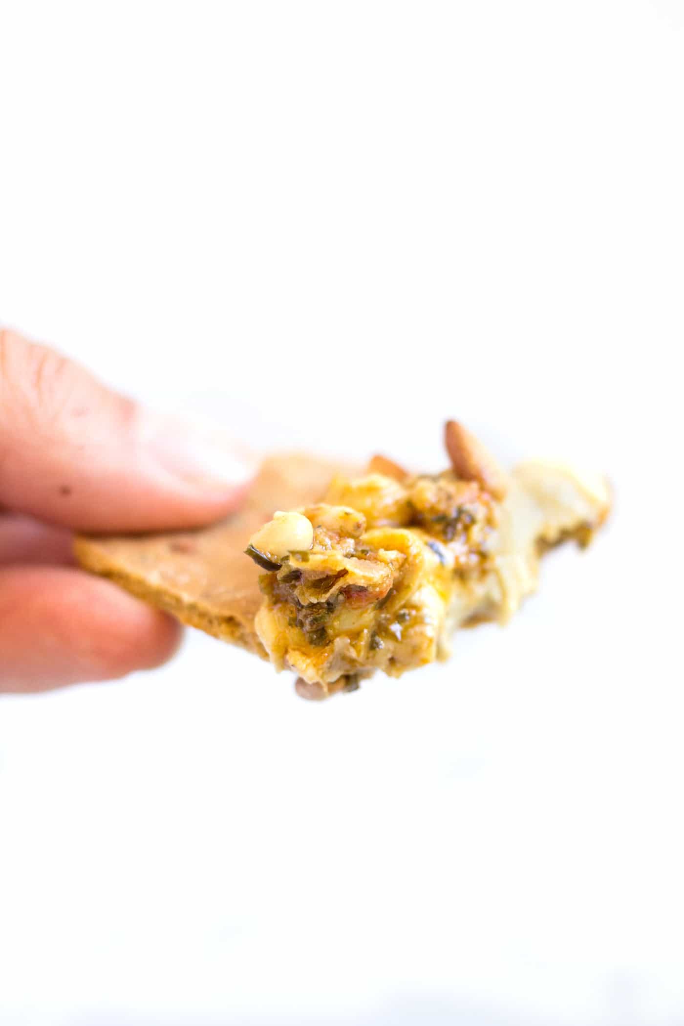 SIMPLE QUINOA CRACKERS dipped in a roasted pine nut hummus...the perfect snack or appetizer!