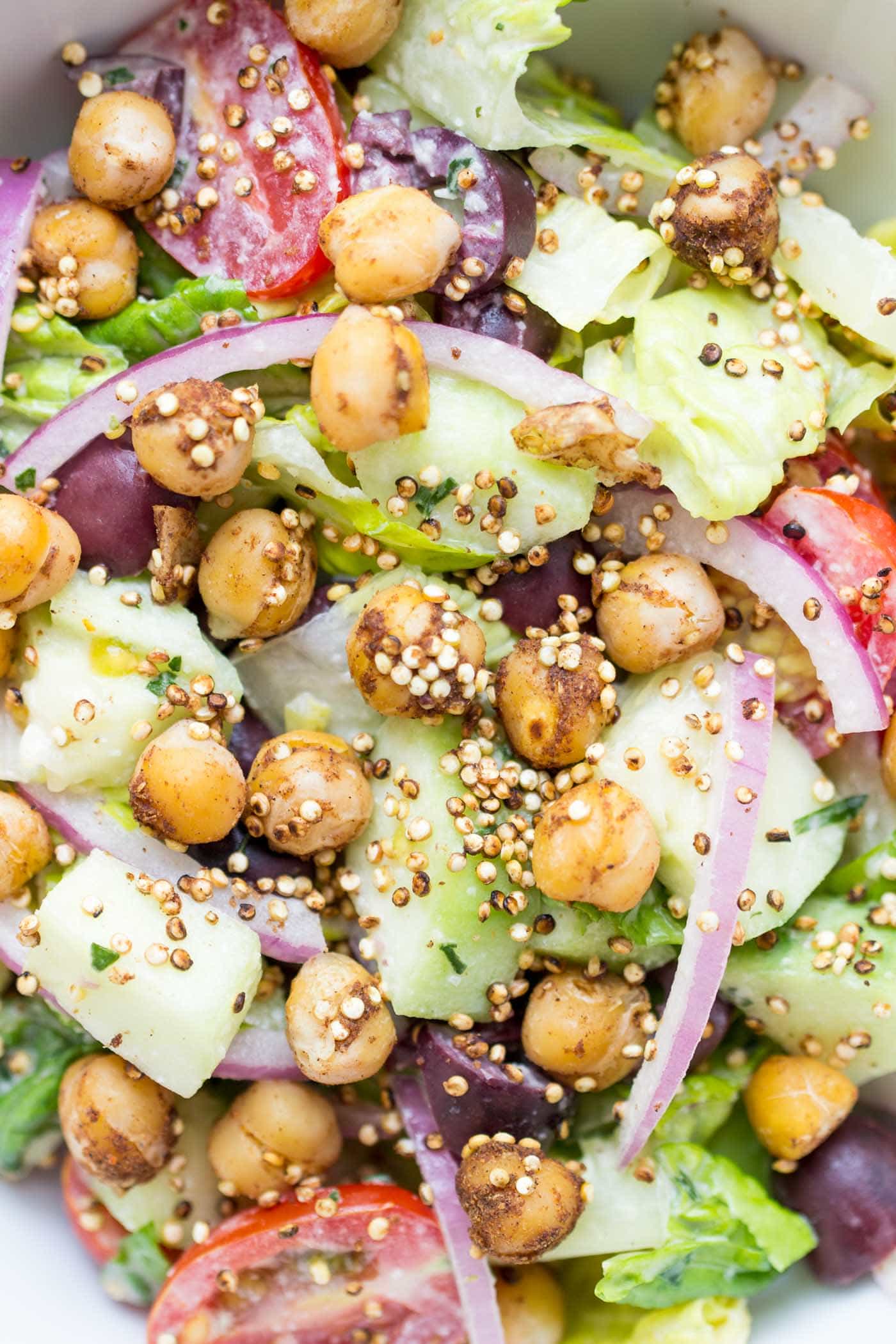 This vegan chopped salad is SO GOOD -- topped with a tarragon tahini dressing and warm spiced chickpeas!