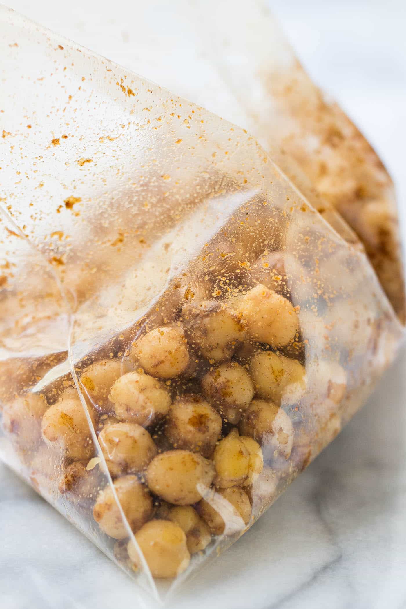 How to make the perfect warm chickpeas -- tossed in a bag with a little oil, tons of spices and then sauteed in a pan. Simple, easy, DELISH!