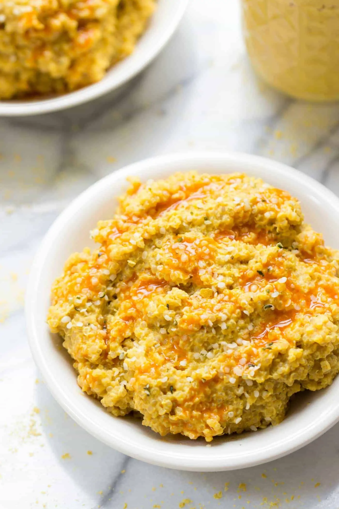 Buffalo Quinoa Mac + Cheese -- made with a vegan cauliflower sauce that's super creamy and SO HEALTHY!