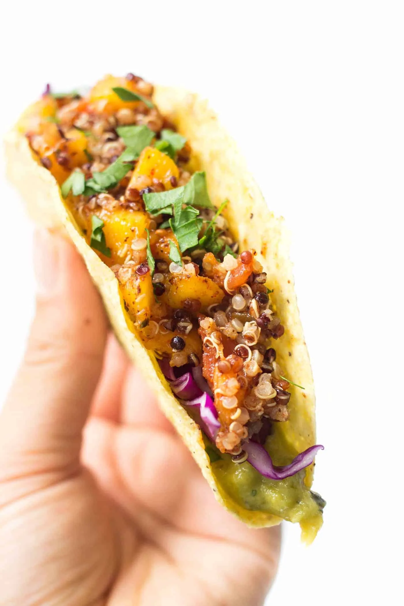 Mango-Lime Quinoa Tacos -- with a spicy meatless filling, creamy guacamole and crunchy red cabbage! So simple and SO HEALTHY! [vegan]