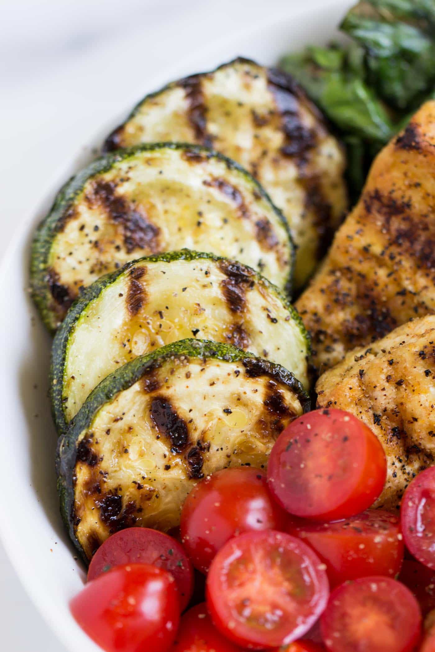 Perfectly grilled zucchini atop of delicious pesto quinoa bowl -- looks like the perfect dinner to me!