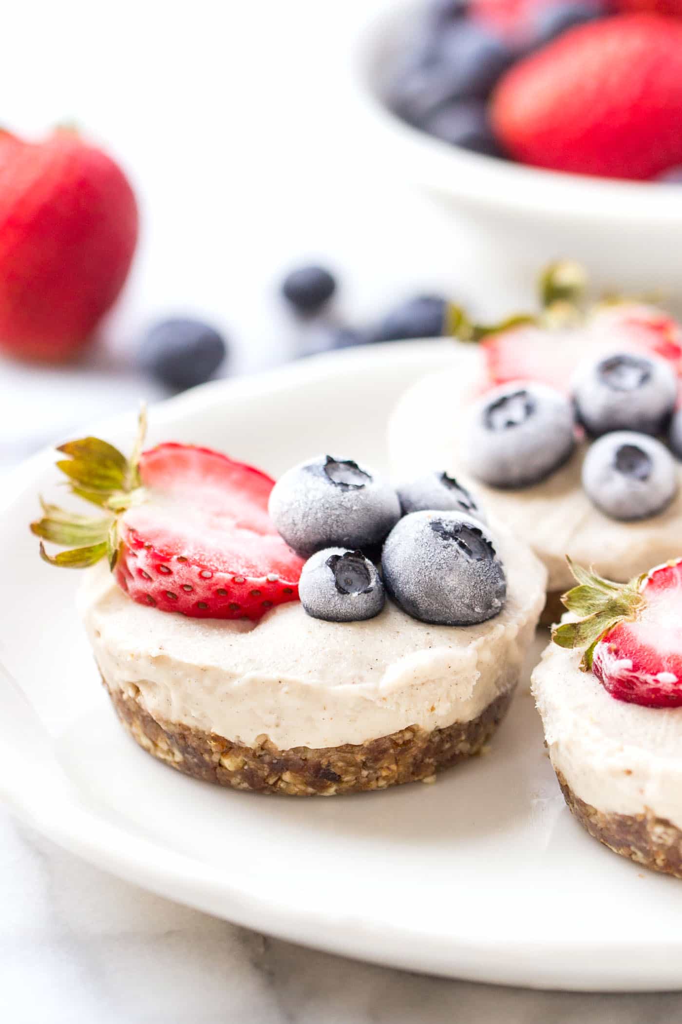 No-Bake Frozen Berry Tarts with a creamy coconut filling and a pecan-date crust! It's the ultimate summertime treat! [VEGAN]