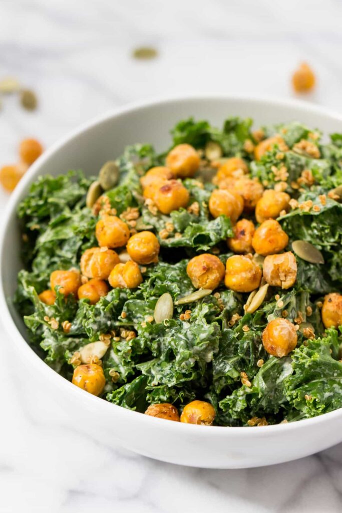 vegan kale caesar salad with crispy chickpeas on top