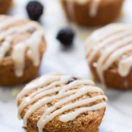 Blackberry Lime Oatmeal Muffins topped with a creamy coconut butter glaze! Naturally gluten-free, without any dairy, oils or eggs!