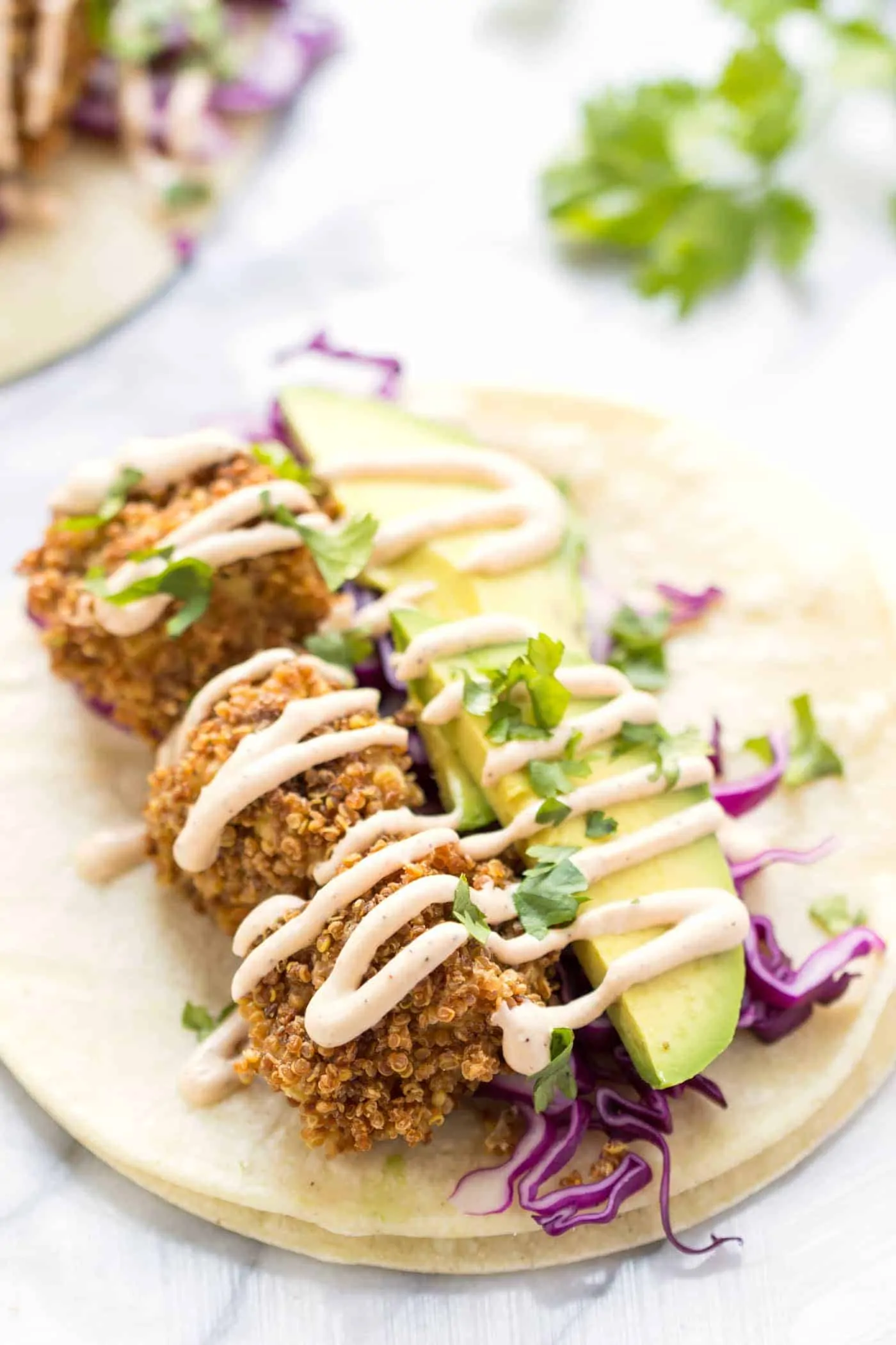 CRISPY TOFU TACOS! made with quinoa crusted baked tofu and served with a vegan lime crema!