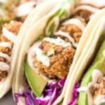 CRISPY TOFU TACOS! made with quinoa crusted baked tofu and served with a vegan lime crema!