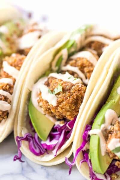 CRISPY TOFU TACOS! made with quinoa crusted baked tofu and served with a vegan lime crema!