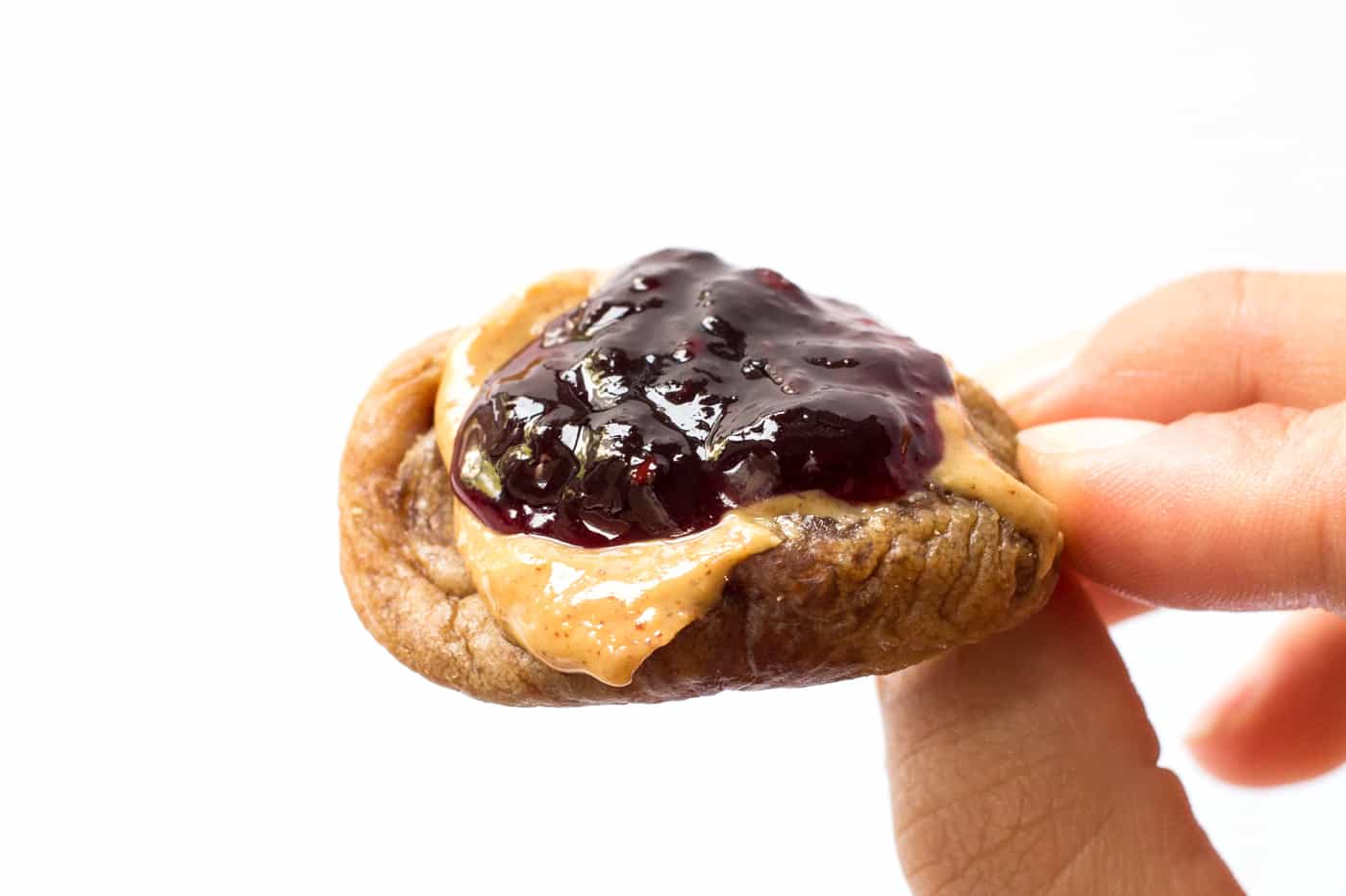 The BEST snack in the entire world -- dried turkish fig with creamy peanut butter and jam!