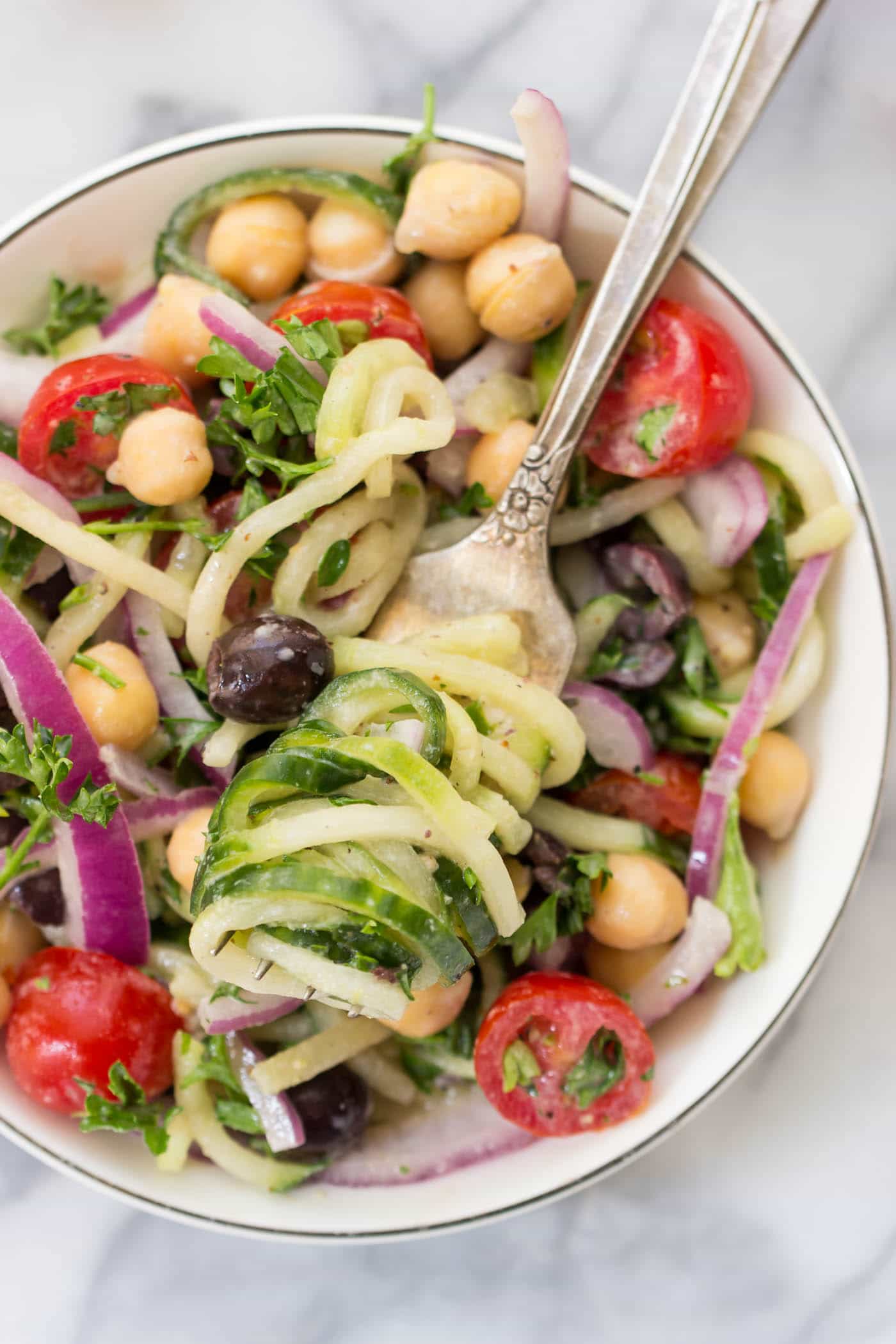 Cucumber Noodle Greek Salad -- a light and refreshing pasta salad that is healthy and satisfying!